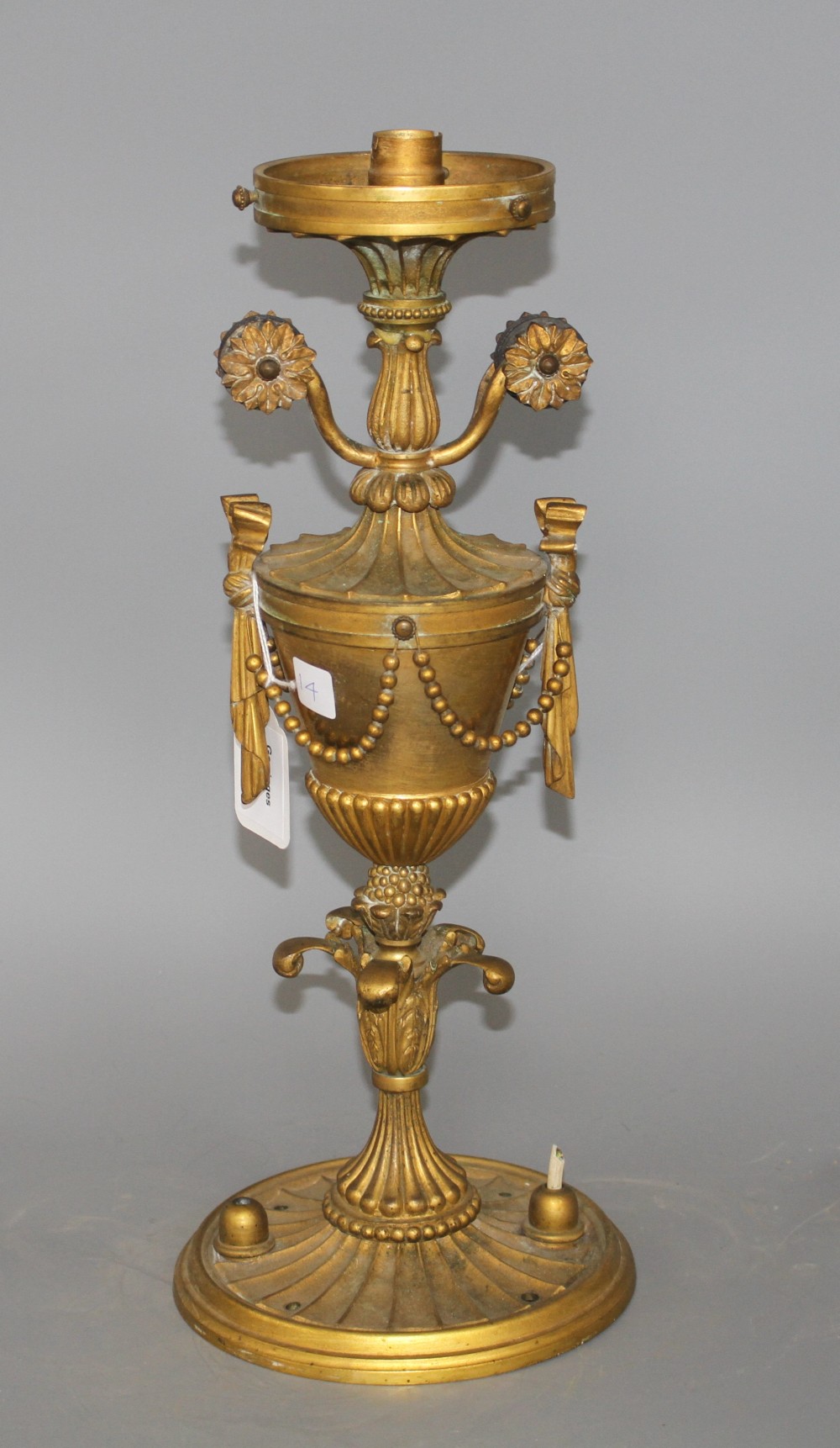 An early 20th century ormolu light fitting, lacking glass shade, height 41cm